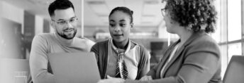 young-couple-and-their-financial-advisor-using-laptop-during-a-meeting-in-the-office