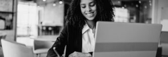 businesswoman-using-laptop-at-desk